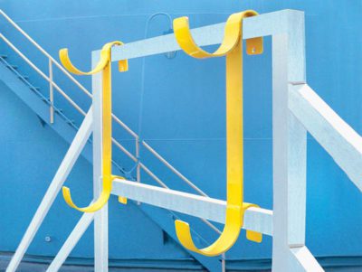 Aldon railcar hose rack for storage of tank car hoses on railings